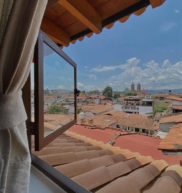 Rooftop view over Valle de Bravo from a room window